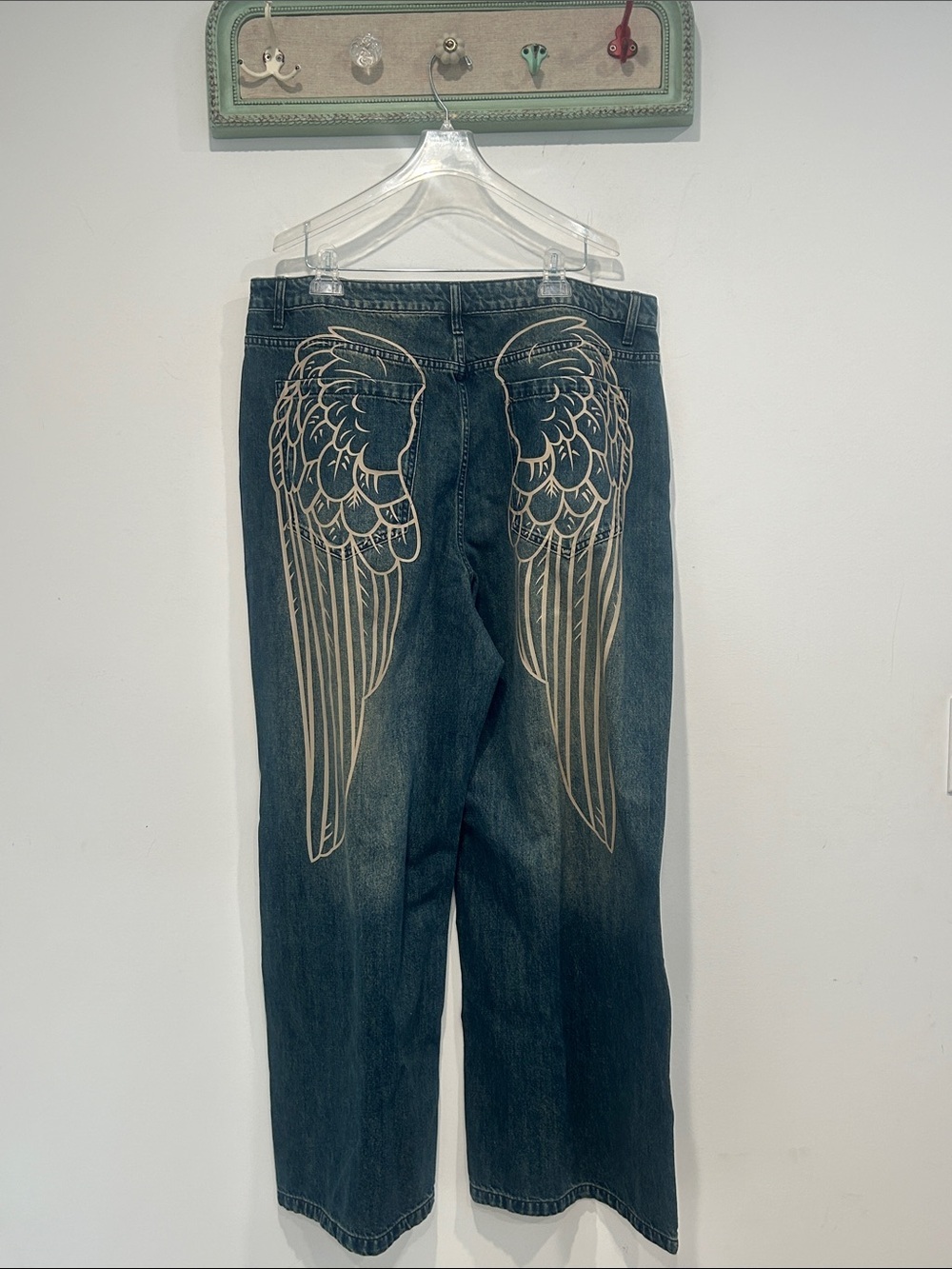Dolls Kill Dark Wash Jeans with Angel Wing Back Print